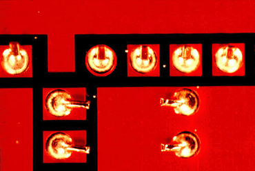 Figure 5: Solder balls on this board were caused by spitting from the surface of the wave Figure 5: Solder balls on this board were caused by spitting from the surface of the wave